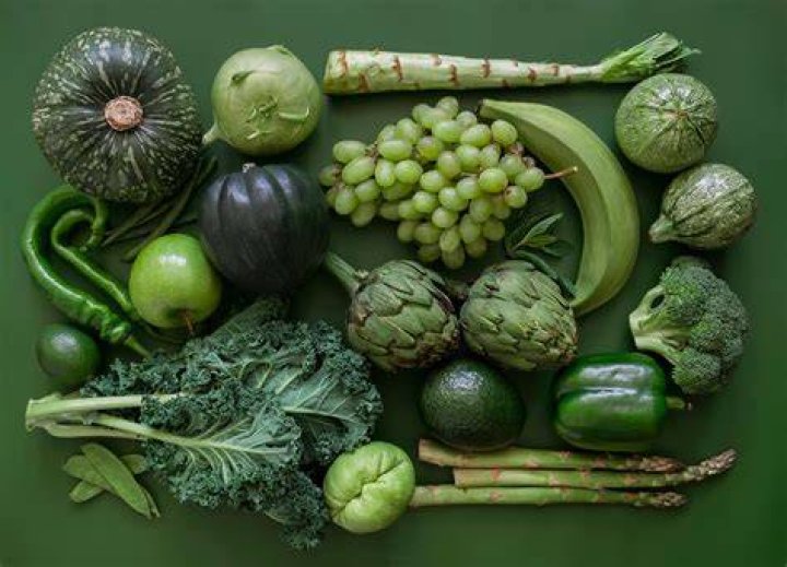 Why are dark green vegetables a good source of vitamin A?